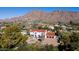 Aerial view of house, large motor court, and mountain views at 4417 N Camino Allenada --, Phoenix, AZ 85018