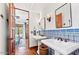 Double vanity bathroom with decorative tile and a view into bedroom at 4417 N Camino Allenada --, Phoenix, AZ 85018