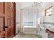 Elegant bathroom with subway tile, a freestanding tub, and a decorative chandelier at 4417 N Camino Allenada --, Phoenix, AZ 85018