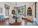 Elegant dining room featuring a large table, built-in cabinetry, and terracotta tile floors at 4417 N Camino Allenada --, Phoenix, AZ 85018