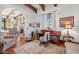 Functional home office with hardwood floors and a view into the living room at 4417 N Camino Allenada --, Phoenix, AZ 85018