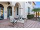 Peaceful patio with wrought iron furniture and a view of the landscape at 4417 N Camino Allenada --, Phoenix, AZ 85018