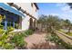 Landscaped side yard with a walkway and lush greenery at 4417 N Camino Allenada --, Phoenix, AZ 85018