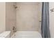 Shower stall with gray tile and a gray shower curtain at 4622 W Desert Crest Dr, Glendale, AZ 85301