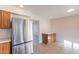 Modern kitchen with stainless steel refrigerator and ample cabinet space at 4622 W Desert Crest Dr, Glendale, AZ 85301