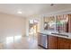 Kitchen with a view to the backyard and stainless steel dishwasher at 4622 W Desert Crest Dr, Glendale, AZ 85301