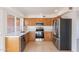 Well-equipped kitchen featuring stainless steel appliances and wood cabinets at 4622 W Desert Crest Dr, Glendale, AZ 85301