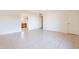 Open living room with tile flooring and a view to the kitchen at 4622 W Desert Crest Dr, Glendale, AZ 85301