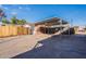 Covered parking area with metal carport and wooden fence at 4622 W Desert Crest Dr, Glendale, AZ 85301