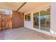 Covered patio with sliding glass door and wooden fence at 4622 W Desert Crest Dr, Glendale, AZ 85301