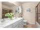 Bathroom with double vanity, shower, and bathtub at 4639 W Becker Ln, Glendale, AZ 85304