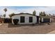 White single story home with a gray garage door and neatly landscaped front yard at 4639 W Becker Ln, Glendale, AZ 85304