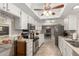 Updated kitchen with stainless steel appliances and white cabinets at 4639 W Becker Ln, Glendale, AZ 85304