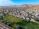 Aerial view of community near golf course and mountain views at 5018 E Siesta Dr # 3, Phoenix, AZ 85044