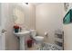 Clean and modern half bathroom with pedestal sink at 5018 E Siesta Dr # 3, Phoenix, AZ 85044