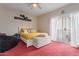 Bright bedroom with a king-size bed, balcony access, and a beanbag chair at 5018 E Siesta Dr # 3, Phoenix, AZ 85044