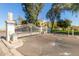 Gated community entrance with ornate iron gates and landscaped grounds at 5018 E Siesta Dr # 3, Phoenix, AZ 85044