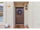 Inviting front entrance with a brown door and decorative wreath at 5018 E Siesta Dr # 3, Phoenix, AZ 85044