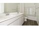 Bright bathroom featuring double vanity, bathtub, and tiled floor at 5018 W Walatowa St, Laveen, AZ 85339