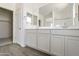 Elegant bathroom with double sinks, large mirror, and walk-in shower at 5018 W Walatowa St, Laveen, AZ 85339