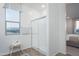 Modern bathroom with walk-in shower and window view at 5018 W Walatowa St, Laveen, AZ 85339