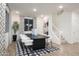 Bright dining area with black table, white chairs and staircase view at 5018 W Walatowa St, Laveen, AZ 85339