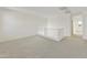 Spacious loft with carpeted floors and hallway access to bedroom and bathroom at 5018 W Walatowa St, Laveen, AZ 85339