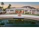 Stunning lakefront property with expansive backyard and private dock at 5287 W Quail Ave, Glendale, AZ 85308