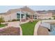 Landscaped backyard with patio and lake access at 5287 W Quail Ave, Glendale, AZ 85308