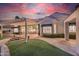 Serene backyard with a pergola-covered patio and lush green lawn at 5287 W Quail Ave, Glendale, AZ 85308