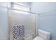 Bathroom with shower/tub combo and blue accents at 5287 W Quail Ave, Glendale, AZ 85308