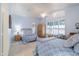 Guest bedroom with two twin beds and wood wardrobe at 5287 W Quail Ave, Glendale, AZ 85308