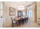 Elegant dining room with large table and chandelier at 5287 W Quail Ave, Glendale, AZ 85308