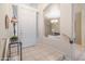 Bright and airy entryway with tiled floors and elegant chandelier at 5287 W Quail Ave, Glendale, AZ 85308