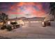 Single-story home with attached two-car garage and desert landscaping at 5287 W Quail Ave, Glendale, AZ 85308