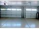 Large three-car garage with automatic openers and painted floor at 5287 W Quail Ave, Glendale, AZ 85308