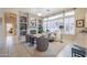 Cozy Gathering room with a fireplace and built-in shelves at 5287 W Quail Ave, Glendale, AZ 85308