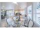 Bright kitchen with breakfast nook, white cabinets, and glass table at 5287 W Quail Ave, Glendale, AZ 85308