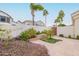 Landscaped courtyard with stone pathway and lush greenery at 5287 W Quail Ave, Glendale, AZ 85308