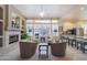 Open floor plan living room with fireplace and kitchen view at 5287 W Quail Ave, Glendale, AZ 85308