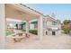 Built-in outdoor kitchen with seating area at 5287 W Quail Ave, Glendale, AZ 85308