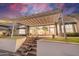 Elegant patio featuring a pergola, stairs, and lush landscaping at 5287 W Quail Ave, Glendale, AZ 85308