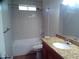 Updated bathroom with tub, shower, and granite vanity at 5843 W Crocus Dr, Glendale, AZ 85306