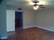 Spacious bedroom with tile flooring and ceiling fan at 5843 W Crocus Dr, Glendale, AZ 85306