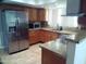 Well-equipped kitchen with granite counters and stainless steel fridge at 5843 W Crocus Dr, Glendale, AZ 85306