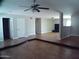 Open living room with tile floors and a ceiling fan at 5843 W Crocus Dr, Glendale, AZ 85306