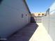 Side yard with a concrete patio, gate, and block wall at 5843 W Crocus Dr, Glendale, AZ 85306