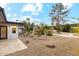 Landscaped backyard with a rock pathway and pool in background at 5960 E Pershing Ave, Scottsdale, AZ 85254