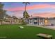 Large backyard with two gazebos, putting green, and cornhole at 5960 E Pershing Ave, Scottsdale, AZ 85254