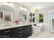 Elegant bathroom featuring a freestanding tub and double vanity with marble top at 5960 E Pershing Ave, Scottsdale, AZ 85254